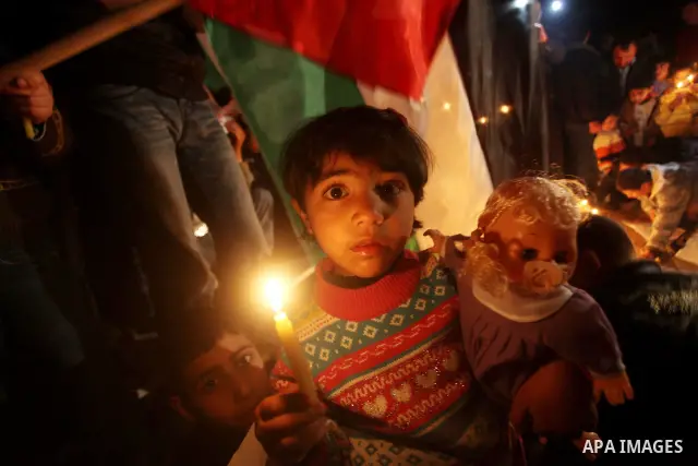Palestinian children hold candles during a protest calling for power in Gaza City, on March 29, 2012. The Red Cross said on March, 29 it would ship emergency supplies of fuel to help alleviate the Gaza Strip's worsening...