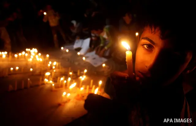 Palestinian children hold candles during a protest calling for power in Gaza City, on March 29, 2012. The Red Cross said on March, 29 it would ship emergency supplies of fuel to help alleviate the Gaza Strip's worsening...