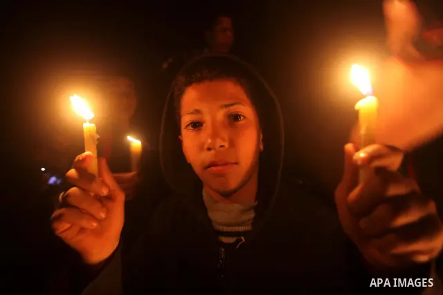Palestinian children hold candles during a protest calling for power in Gaza City, on March 29, 2012. The Red Cross said on March, 29 it would ship emergency supplies of fuel to help alleviate the Gaza Strip's worsening...