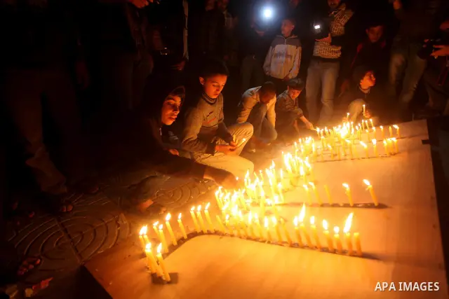 Palestinian children hold candles during a protest calling for power in Gaza City, on March 29, 2012. The Red Cross said on March, 29 it would ship emergency supplies of fuel to help alleviate the Gaza Strip's worsening...