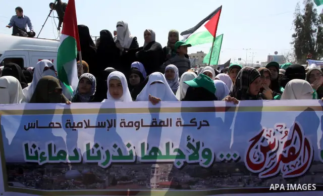 Palestinian protesters take part in a protest marking Land Day, near the border between Israel and the northern Gaza Strip March 30, 2012. Israeli security forces fired rubber bullets, tear gas and stun grenades to break...
