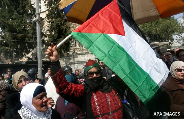 Palestinian protesters take part in a demonstration on Land Day outside Damascus Gate in Jerusalem's Old City March 30, 2012. Israeli security forces fired rubber bullets, tear gas and stun grenades to break up groups of...