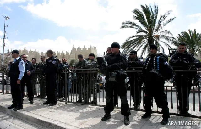 Israeli security officers stand guard before Friday prayers on Land Day outside Damascus Gate in Jerusalem's Old City March 30, 2012. Israeli security forces fired rubber bullets, tear gas and stun grenades to break up g...