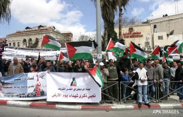 Palestinian protesters take part in a demonstration on Land Day outside Damascus Gate in Jerusalem's Old City March 30, 2012. Israeli security forces fired rubber bullets, tear gas and stun grenades to break up groups of...