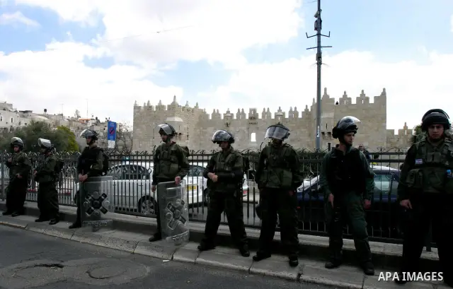 Israeli security officers stand guard before Friday prayers on Land Day outside Damascus Gate in Jerusalem's Old City March 30, 2012. Israeli security forces fired rubber bullets, tear gas and stun grenades to break up g...