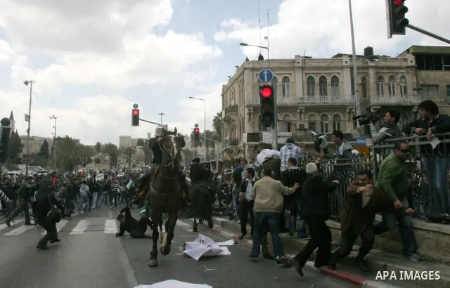 Israeli police officers on horseback scuffle with Palestinians during clashes on Land Day after Friday prayers outside Damascus Gate in Jerusalem's Old City March 30, 2012. Israeli security forces fired rubber bullets, t...