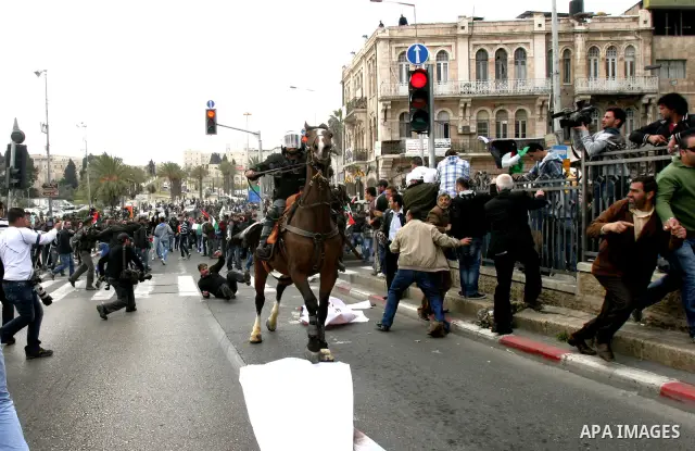 Israeli police officers on horseback scuffle with Palestinians during clashes on Land Day after Friday prayers outside Damascus Gate in Jerusalem's Old City March 30, 2012. Israeli security forces fired rubber bullets, t...