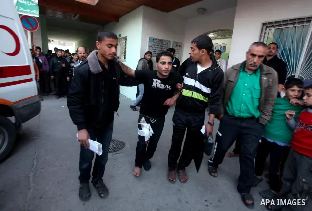 A wounded Palestinian receives medical care at a hospital in northern Gaza Strip, after being injured during protests on Land Day close to the border with Israel in the northern Gaza Strip Friday, March 30, 2012. Israeli...