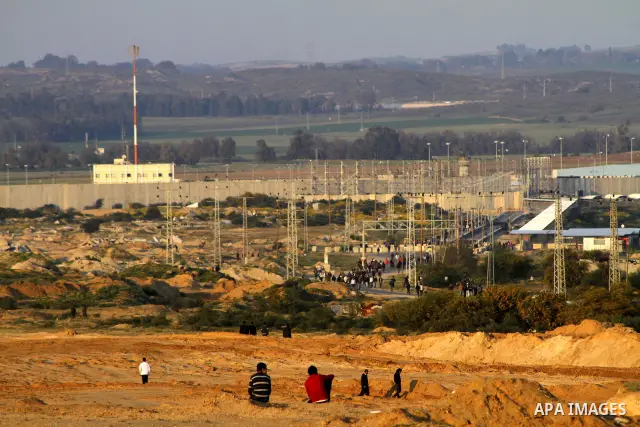 Palestinian protesters take part in a protest marking Land Day, near the border between Israel and the northern Gaza Strip March 30, 2012. Israeli security forces fired rubber bullets, tear gas and stun grenades to break...