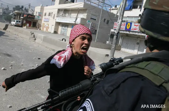 Foreign activists scuffle with Israeli security forces during clashes at a demonstration marking Land Day, at Qalandiya checkpoint, near the West Bank city of Ramallah March 30, 2012. Israeli security forces fired rubber...