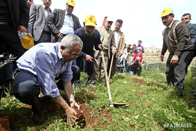 Palestinian Prime Minister, Salam Fayyad, participates during the cultivation of olive trees on the occasion of "Land Day", in the West Bank city of Bethlehem, on Mar. 31, 2012. Photo by Mustafa Abu Dayah