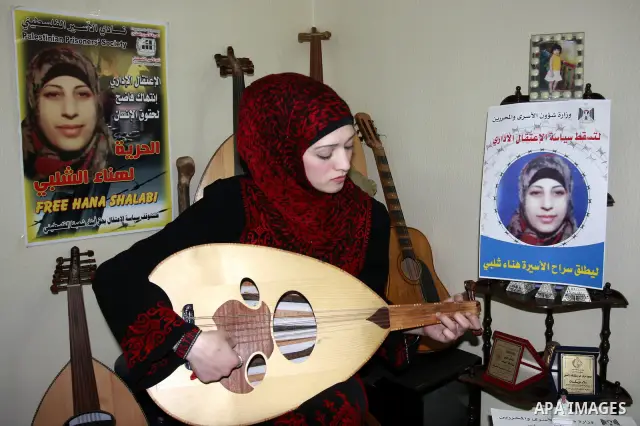 Palestinian Walaa Dwikat sings and plays oud ? supporting the palestinian prisoner Hanaa Shalabi in Balata in the West Bank., Sunday, April 1, 2012. Photo by Wagdi Eshtayah