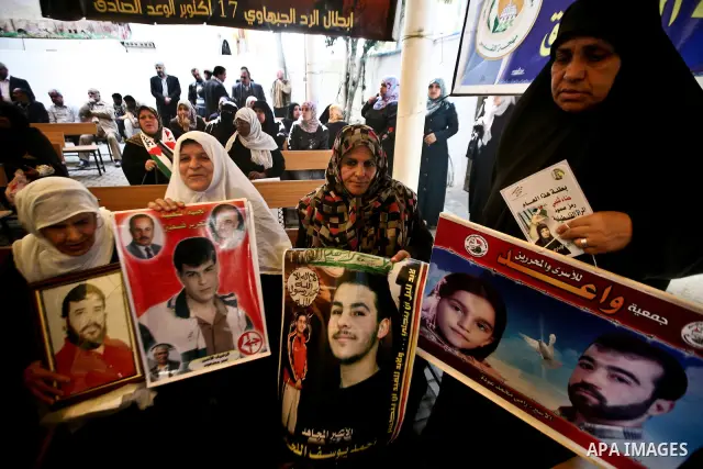 Palestinian relatives prisoners attend a protest calling for the release of their sons held in Israeli jails next the International Red Cross in Gaza City, Gaza Strip, on Apr. 02, 2012. Photo by Ali Jadallah