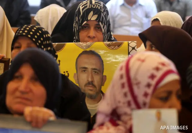 Palestinian relatives prisoners attend a protest calling for the release of their sons held in Israeli jails next the International Red Cross in Gaza City, Gaza Strip, on Apr. 02, 2012. Photo by Mohammed Asad