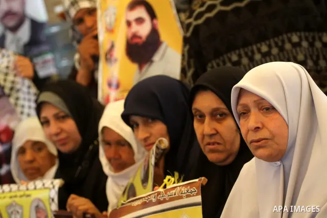 Palestinian relatives prisoners attend a protest calling for the release of their sons held in Israeli jails next the International Red Cross in Gaza City, Gaza Strip, on Apr. 02, 2012. Photo by Mohammed Asad