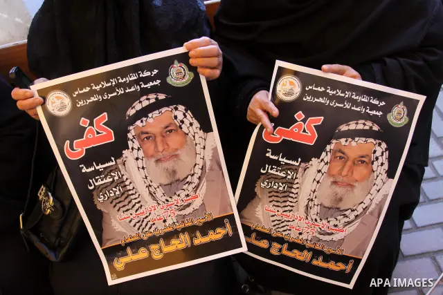 Palestinian relatives prisoners attend a protest calling for the release of their sons held in Israeli jails next the International Red Cross in Gaza City, Gaza Strip, on Apr. 02, 2012. Photo by Mohammed Asad