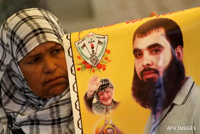 Palestinian relatives prisoners attend a protest calling for the release of their sons held in Israeli jails next the International Red Cross in Gaza City, Gaza Strip, on Apr. 02, 2012. Photo by Mohammed Asad