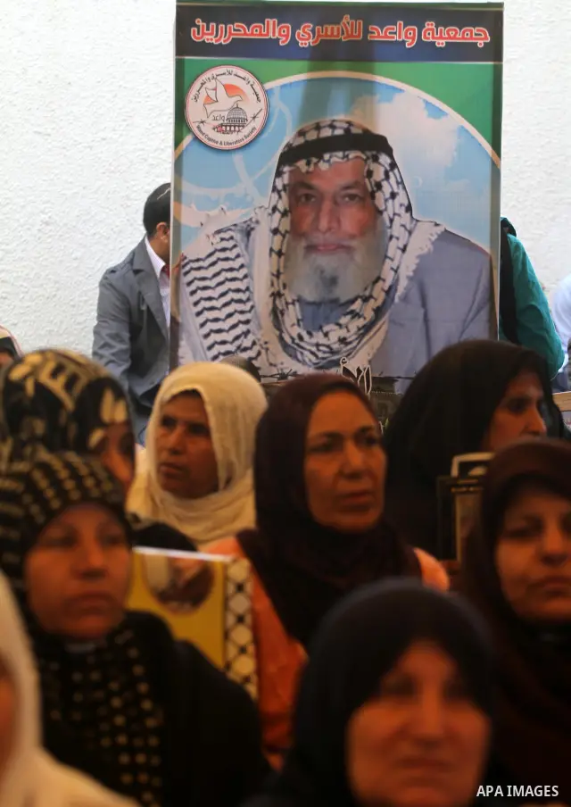Palestinian relatives prisoners attend a protest calling for the release of their sons held in Israeli jails next the International Red Cross in Gaza City, Gaza Strip, on Apr. 02, 2012. Photo by Mohammed Asad