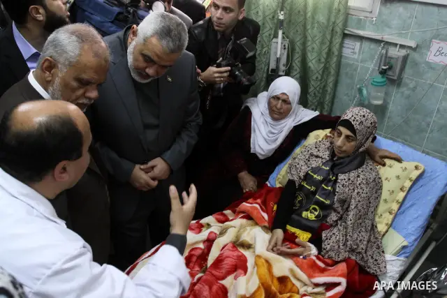 Palestinian Hamas premier in the Gaza Strip, Ismail Haniya visits Palestinian prisoner Hanaa Shalabi, who spent 43 days on hunger strike in an Israeli prison, in Al-Shefa hospital in Gaza City on April 2, 2012. Shalabi,...