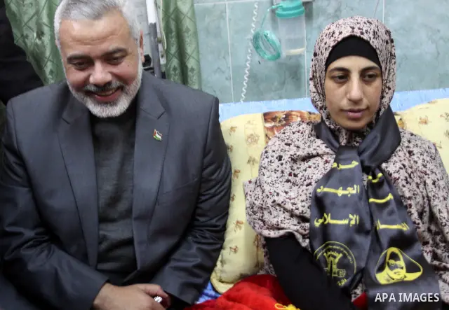 Palestinian Hamas premier in the Gaza Strip, Ismail Haniya visits Palestinian prisoner Hanaa Shalabi, who spent 43 days on hunger strike in an Israeli prison, in Al-Shefa hospital in Gaza City on April 2, 2012. Shalabi,...