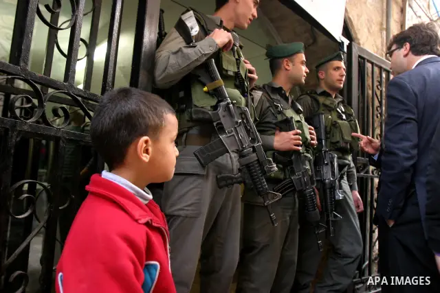 Israelis police stand guard in front of network "Hona Al Quds" in Jerusalem's Old City on Apr. 02, 2012 . Photo by Mahfouz Abu Turk