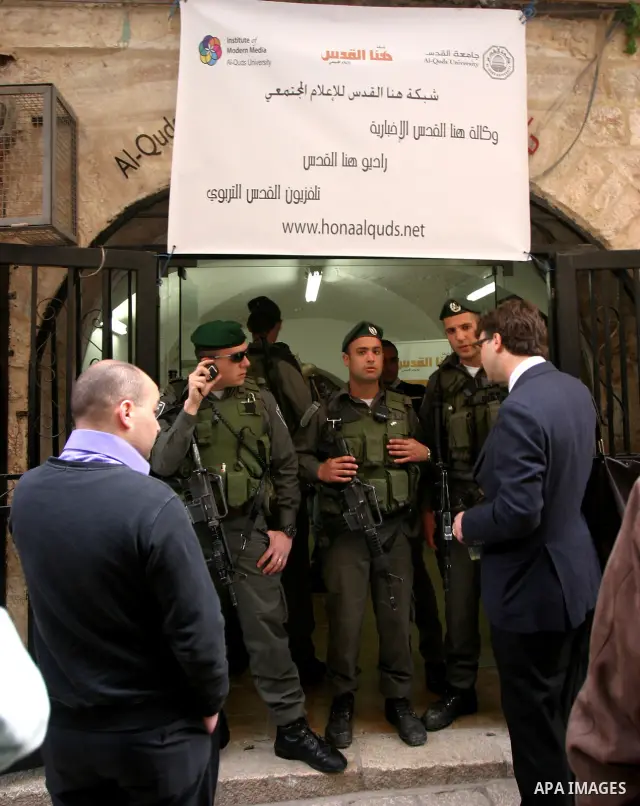 Israelis police stand guard in front of network "Hona Al Quds" in Jerusalem's Old City on Apr. 02, 2012 . Photo by Mahfouz Abu Turk