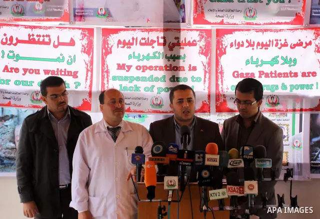 Palestinian officials of the emergency medical, deliver speech during a press conference about the impact of the fuel crisis on the fisherman, in Gaza City, on Apr. 04, 2012. Photo by Mohammed Asad