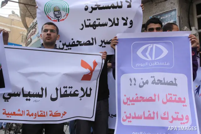 Palestinian journalists protest against arrest of the journalist Yousef Al Shaib in the West Bank, today in Gaza City on Apr. 04, 2012. Photo by Mohammed Asad