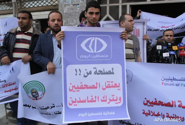 Palestinian journalists protest against arrest of the journalist Yousef Al Shaib in the West Bank, today in Gaza City on Apr. 04, 2012. Photo by Mohammed Asad