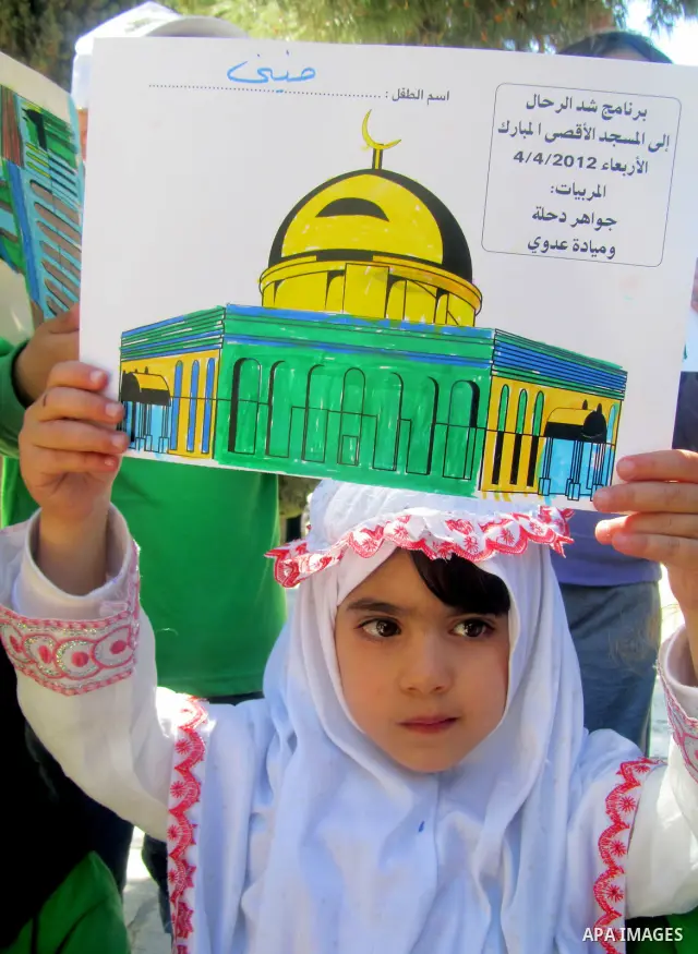 Palestinian children take part protest demonstration near the Dome of the Rock in the Al-Aqsa mosque in Jerusalem city.on Mar. 04, 2012. Photo by Mahfouz Abu Turk