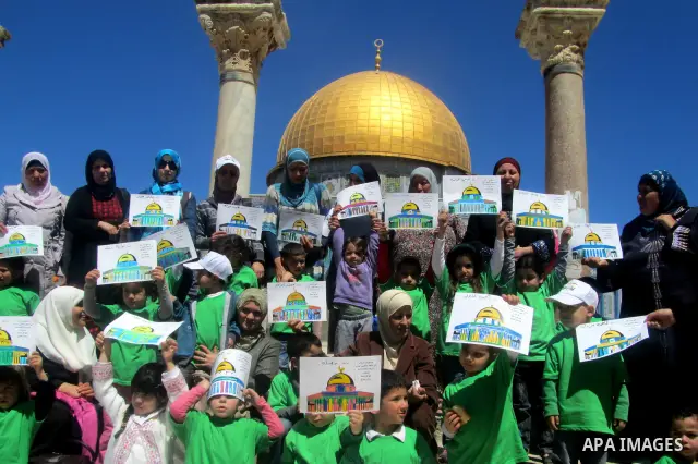 Palestinian children take part protest demonstration near the Dome of the Rock in the Al-Aqsa mosque in Jerusalem city.on Mar. 04, 2012. Photo by Mahfouz Abu Turk