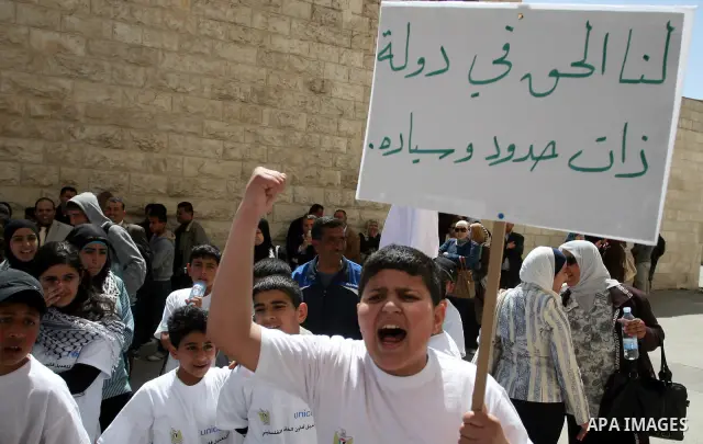 Palestinian children during a demonstration marking International Children's day, in front of the Palestinian Legislative Council in West Bank City of Ramallah, on April 5, 2012. Photo by Issam Rimawi