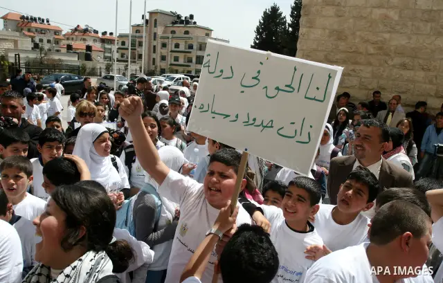 Palestinian children during a demonstration marking International Children's day, in front of the Palestinian Legislative Council in West Bank City of Ramallah, on April 5, 2012. Photo by Issam Rimawi