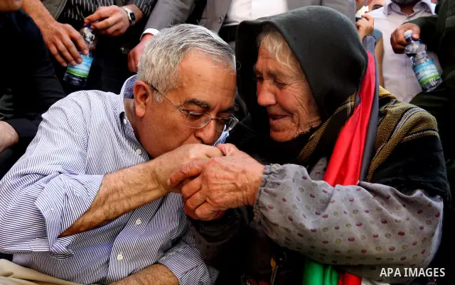 Palestinian Prime Minister Salam Fayyad arrives to pay a visit to support Palestinian farmers in the Yanun village near the West Bank City of Nablus, 05 April 2012. The village was temporarily abandoned by its residents...