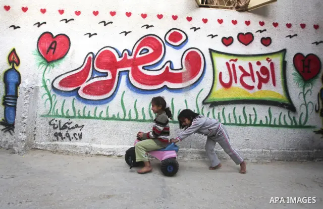 Palestinian children play in the streets of the Jabaliya refugee camp, northern Gaza Strip, 05 April 2012. The United Nations Relief and Works Agency (UNRWA) states that the Israeli blockade on Gaza has made life more di...