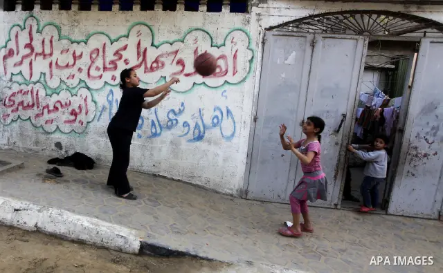 Palestinian children play in the streets of the Jabaliya refugee camp, northern Gaza Strip, 05 April 2012. The United Nations Relief and Works Agency (UNRWA) states that the Israeli blockade on Gaza has made life more di...