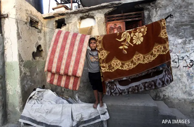 Palestinian children play in the streets of the Jabaliya refugee camp, northern Gaza Strip, 05 April 2012. The United Nations Relief and Works Agency (UNRWA) states that the Israeli blockade on Gaza has made life more di...