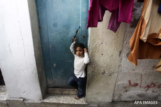 Palestinian children play in the streets of the Jabaliya refugee camp, northern Gaza Strip, 05 April 2012. The United Nations Relief and Works Agency (UNRWA) states that the Israeli blockade on Gaza has made life more di...
