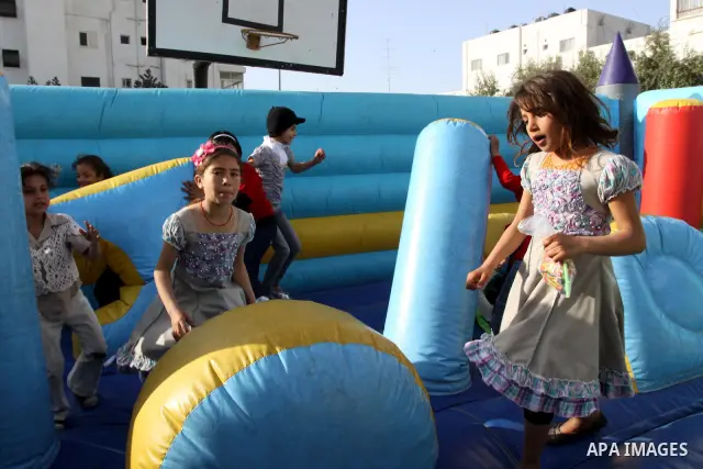 Palestinian children enjoy during celebrations marking Palestinian Children's Day in Gaza City in Gaza city, 06 April 2012. Photo by Mohammed Asad