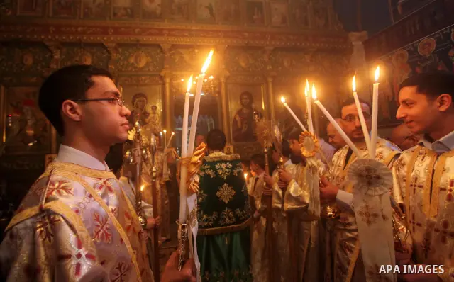 Palestinian Christian Catholics attend an Easter Vigil mass in Gaza City on April 8, 2012. Christians around the world mark the Holy Week of Easter to commemorate the crucifixion and resurrection of Jesus Christ. Photo b...