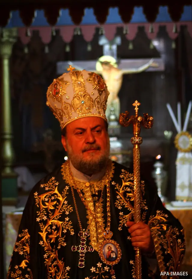 An Orthodox priest leads a Palm Sunday mass at the Saint Porfirios church in Gaza City April 8, 2012. Photo by Ashraf Amra