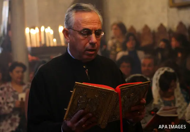 Palestinian Christian Catholics attend an Easter Vigil mass in Gaza City on April 8, 2012. Christians around the world mark the Holy Week of Easter to commemorate the crucifixion and resurrection of Jesus Christ. Photo b...