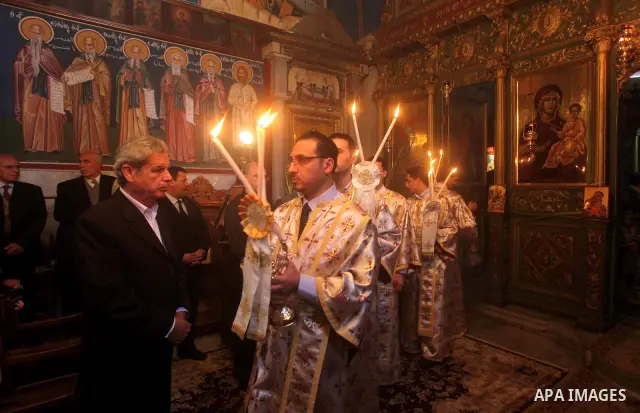 Palestinian Christian Catholics attend an Easter Vigil mass in Gaza City on April 8, 2012. Christians around the world mark the Holy Week of Easter to commemorate the crucifixion and resurrection of Jesus Christ. Photo b...