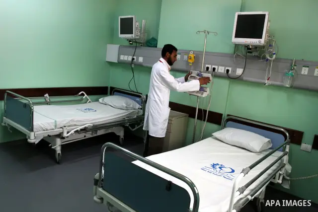 Palestinian Prime Minister in Gaza Strip, Ismail Haniya, (not seen) attends the opening of the public service of the hospital Heart and blood vessels in Gaza City, on Apr. 08, 2012. Photo by Mohammed Asad