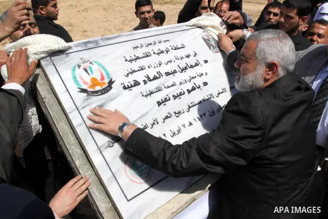 Palestinian Prime Minister in Gaza Strip, Ismail Haniya, lays Black Stone during the opening of the hospital for the elderly in Gaza City, on Apr. 08, 2012. Photo by Mohammed Asad