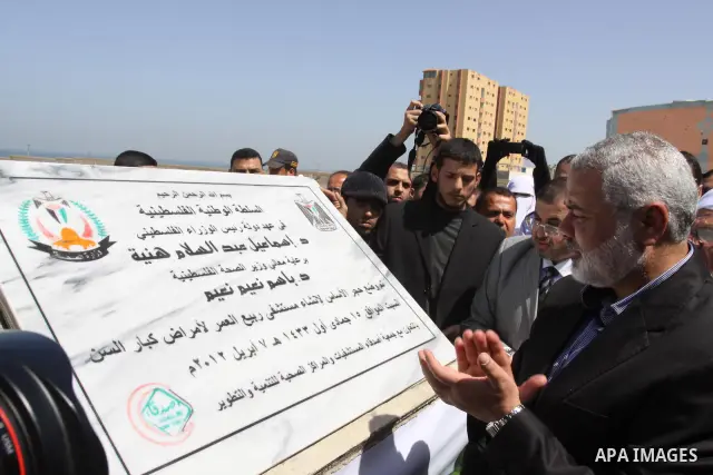 Palestinian Prime Minister in Gaza Strip, Ismail Haniya, lays Black Stone during the opening of the hospital for the elderly in Gaza City, on Apr. 08, 2012. Photo by Mohammed Asad