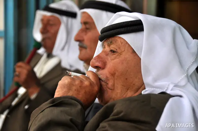 Palestinian elderly smoking waterpipes at cafe in the West Bank city of Nablus, on April, 10, 2012. Photo by Nedal Eshtayah