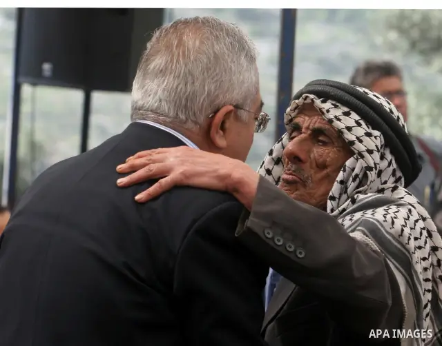 Palestinian Prime Minister Salam Fayyad, participates in the Sixth International Conference of the Bil'in popular resistance, in the village of Bil'in, in the West Bank city of Ramallah April 10, 2012. Photo by Issam Rim...