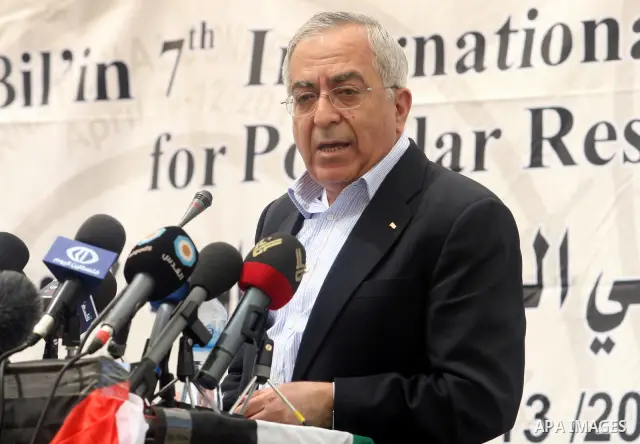 Palestinian Prime Minister Salam Fayyad, participates in the Sixth International Conference of the Bil'in popular resistance, in the village of Bil'in, in the West Bank city of Ramallah April 10, 2012. Photo by Issam Rim...