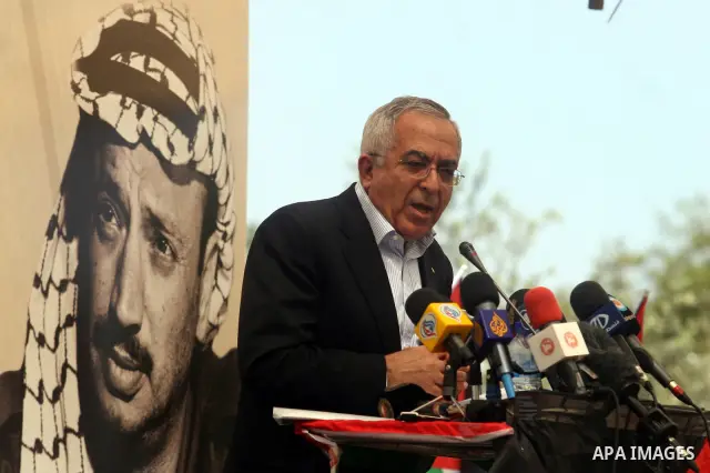 Palestinian Prime Minister Salam Fayyad, participates in the Sixth International Conference of the Bil'in popular resistance, in the village of Bil'in, in the West Bank city of Ramallah April 10, 2012. Photo by Issam Rim...